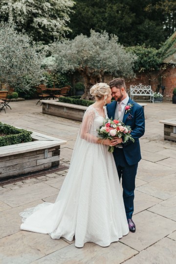 Emma and Neil in courtyard at Shustoke Farm Barns 
