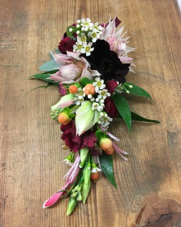 ladies corsage  - deep red and blush blooms -  to match theme of wedding 