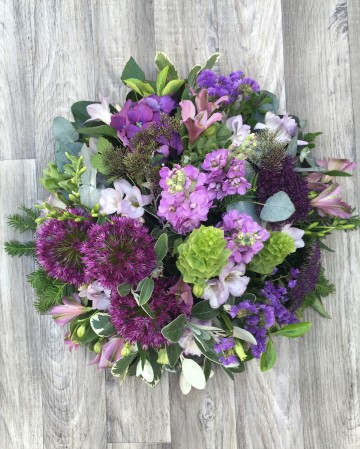 lilac and purple posy display - funeral tribute design - lilac rose - purple lisianthus - allium - freesia