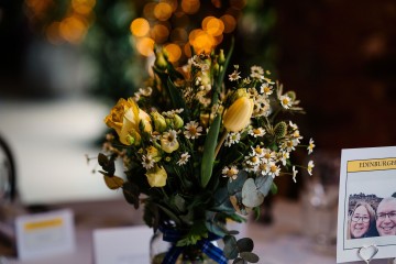 jar of flowers centrepiece at shustoke farm barns - yellow and lemon jar flowers 