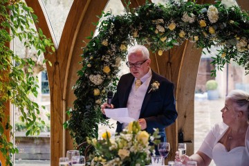 moongate floral display - lemon ivory and yellow flowers 