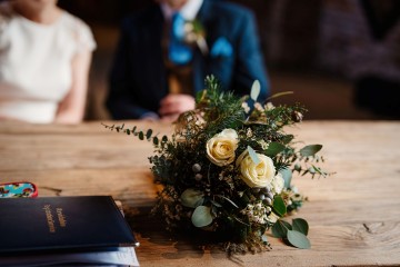 bridal bouquet winter foliage and neutral flowers 