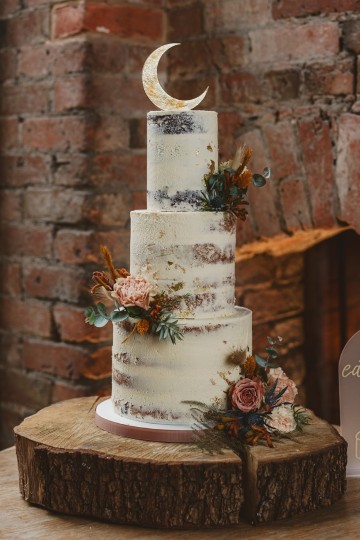 Autumnal wedding at shustoke farm barns - Orange gold navy and nude wedding flowers - quicksand roses - orange roses - blue vibernum - crocosmia - gold fern - floral arch - table plan flowers - wedding cake flowers 