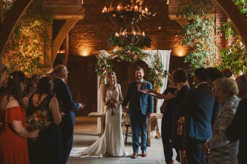 Autumnal wedding at shustoke farm barns - Orange gold navy and nude wedding flowers - quicksand roses - orange roses - blue vibernum - crocosmia - gold fern - floral arch - table plan flowers - wedding cake flowers 