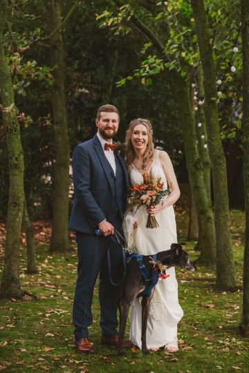 Autumnal wedding at shustoke farm barns - Orange gold navy and nude wedding flowers - quicksand roses - orange roses - blue vibernum - crocosmia - gold fern - floral arch - table plan flowers - wedding cake flowers 