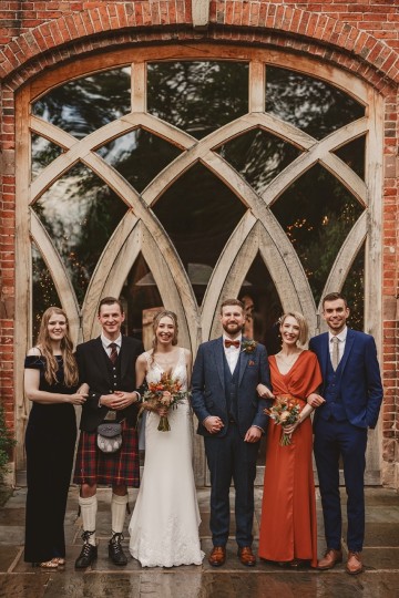 Autumnal wedding at shustoke farm barns - Orange gold navy and nude wedding flowers - quicksand roses - orange roses - blue vibernum - crocosmia - gold fern - floral arch - table plan flowers - wedding cake flowers 