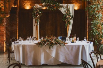 Autumnal wedding at shustoke farm barns - Orange gold navy and nude wedding flowers - quicksand roses - orange roses - blue vibernum - crocosmia - gold fern - floral arch - table plan flowers - wedding cake flowers 