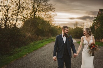 Autumnal wedding at shustoke farm barns - Orange gold navy and nude wedding flowers - quicksand roses - orange roses - blue vibernum - crocosmia - gold fern - floral arch - table plan flowers - wedding cake flowers 