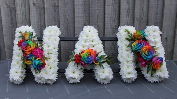 Nan Frame - Based in white chrysanthemum with rainbow rose sprays 