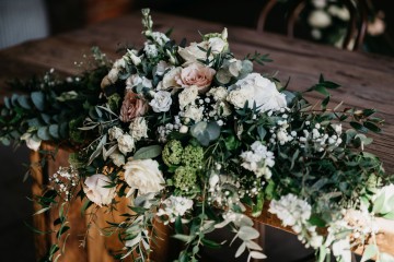 long low ceremony table display nude roses and ivory flowers - quicksand roes - ceremony table display at shustoke farm barn 