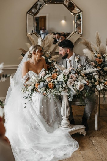 Beautiful wedding at Alrewas Hayes wedding venue - featuring toffee nude and ivory flowers - Toffee roses - Cappuccino Roses - Westminster Abbey Roses - Phalaenopsis orchids - Quicksand Roses - waxflowers - dried Ruscus - Dried Pampas grass - Eucalyptus - Bridal Bouquet