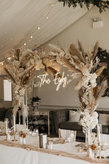 Beautiful wedding at Alrewas Hayes wedding venue - featuring toffee nude and ivory flowers - Toffee roses - Cappuccino Roses - Westminster Abbey Roses - Phalaenopsis orchids - Quicksand Roses - waxflowers - dried Ruscus - Dried Pampas grass - Eucalyptus - Bridal Bouquet