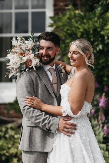 Beautiful wedding at Alrewas Hayes wedding venue - featuring toffee nude and ivory flowers - Toffee roses - Cappuccino Roses - Westminster Abbey Roses - Phalaenopsis orchids - Quicksand Roses - waxflowers - dried Ruscus - Dried Pampas grass - Eucalyptus - Bridal Bouquet