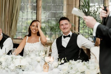 top table display of ivory and white flowers for wedding at Moxhull Hall Hotel 