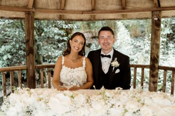 Registrar table flowers  - ivory and white floral displays featuring Hydrangea, Avalanche Rose, Anthuriums, Peony and Gypsophila - at Moxhull Hall wedding Venue