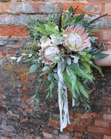 Bridal Bouquet Featuring - Blush King Protea - Blush Ranunculus - White Eryngium - Umberella Fern - Thlaspi - Eucalyptus  With Pheasant Feathers  