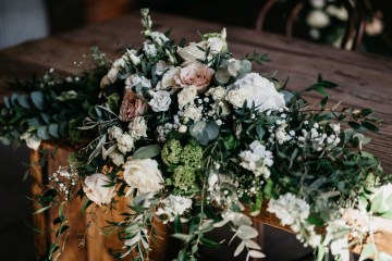long low ceremony table display nude roses and ivory flowers - quicksand roes - ceremony table display at shustoke farm barn 